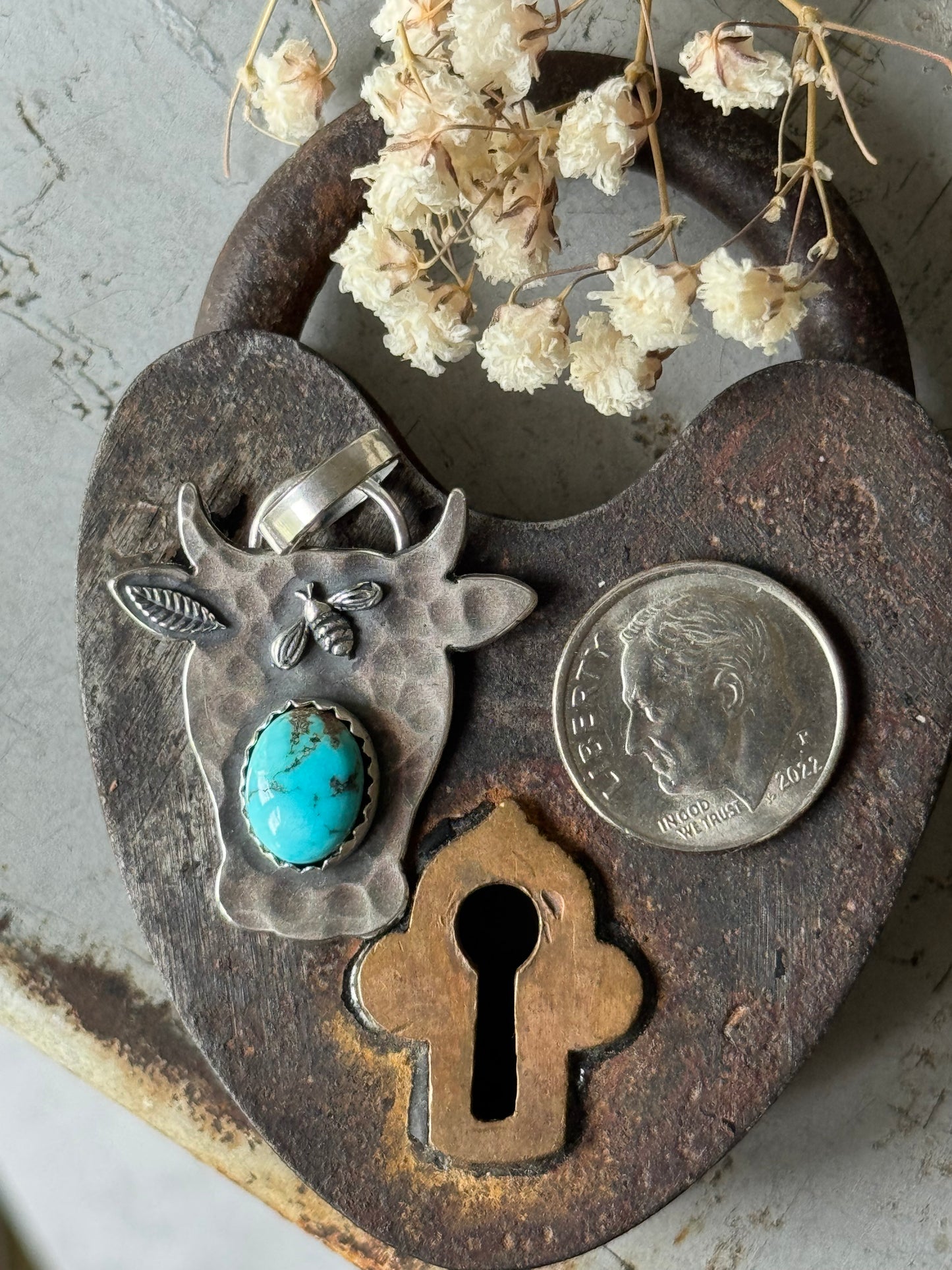 Lone Mountain Turquoise sterling cow pendant